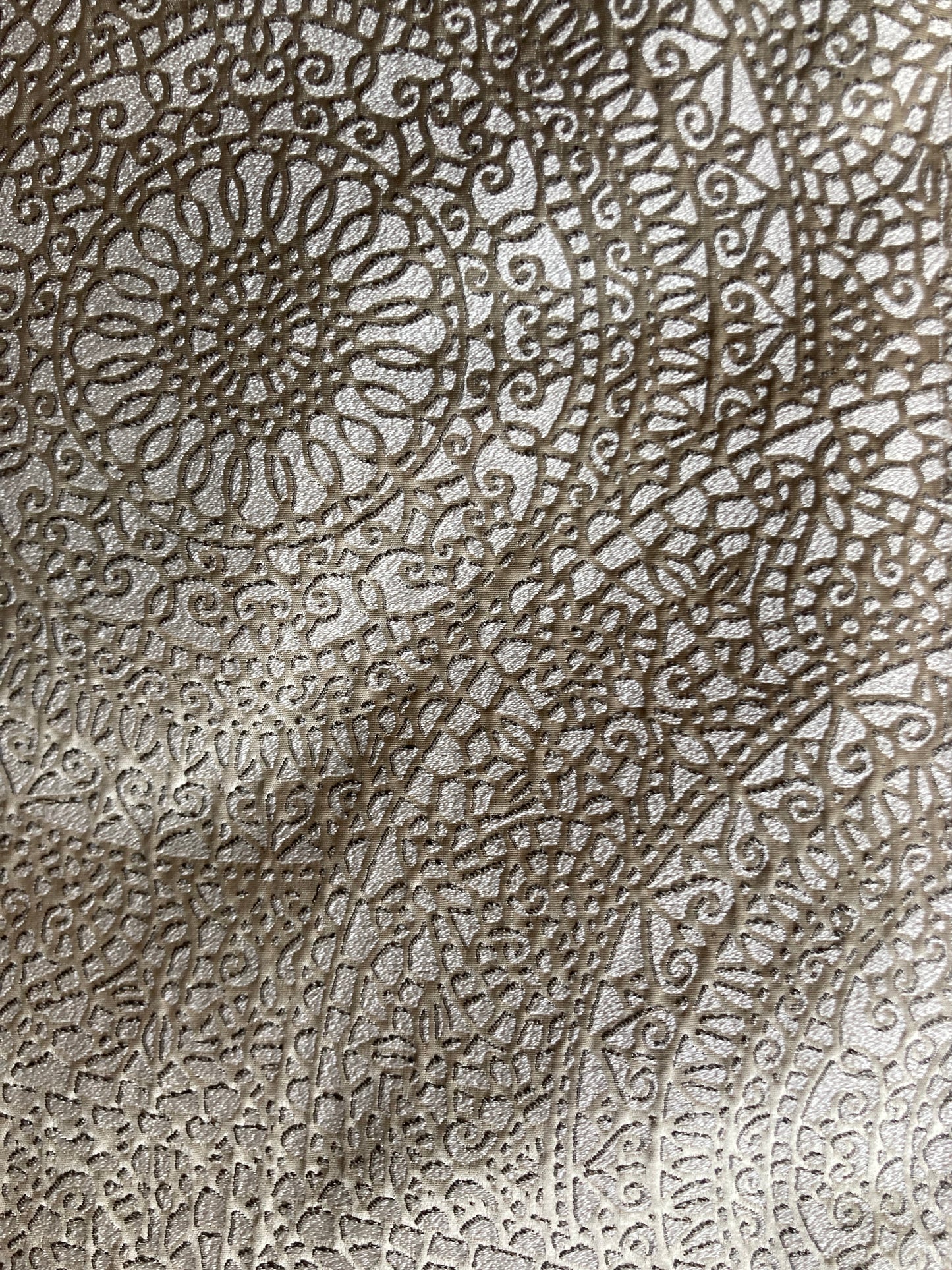 crochet patterns, almost three dimensional in the carefully etched edge cream color