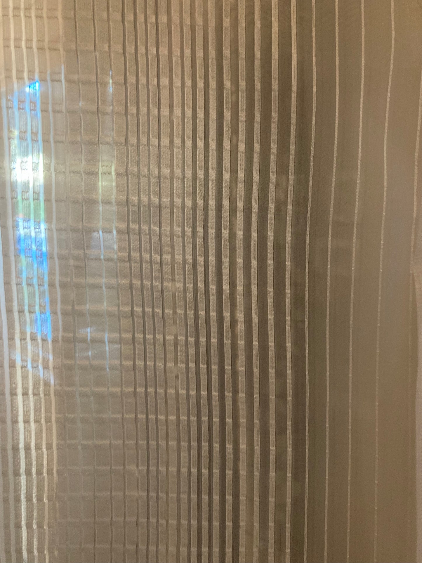 Sheer fabric which allows light to filter through.
