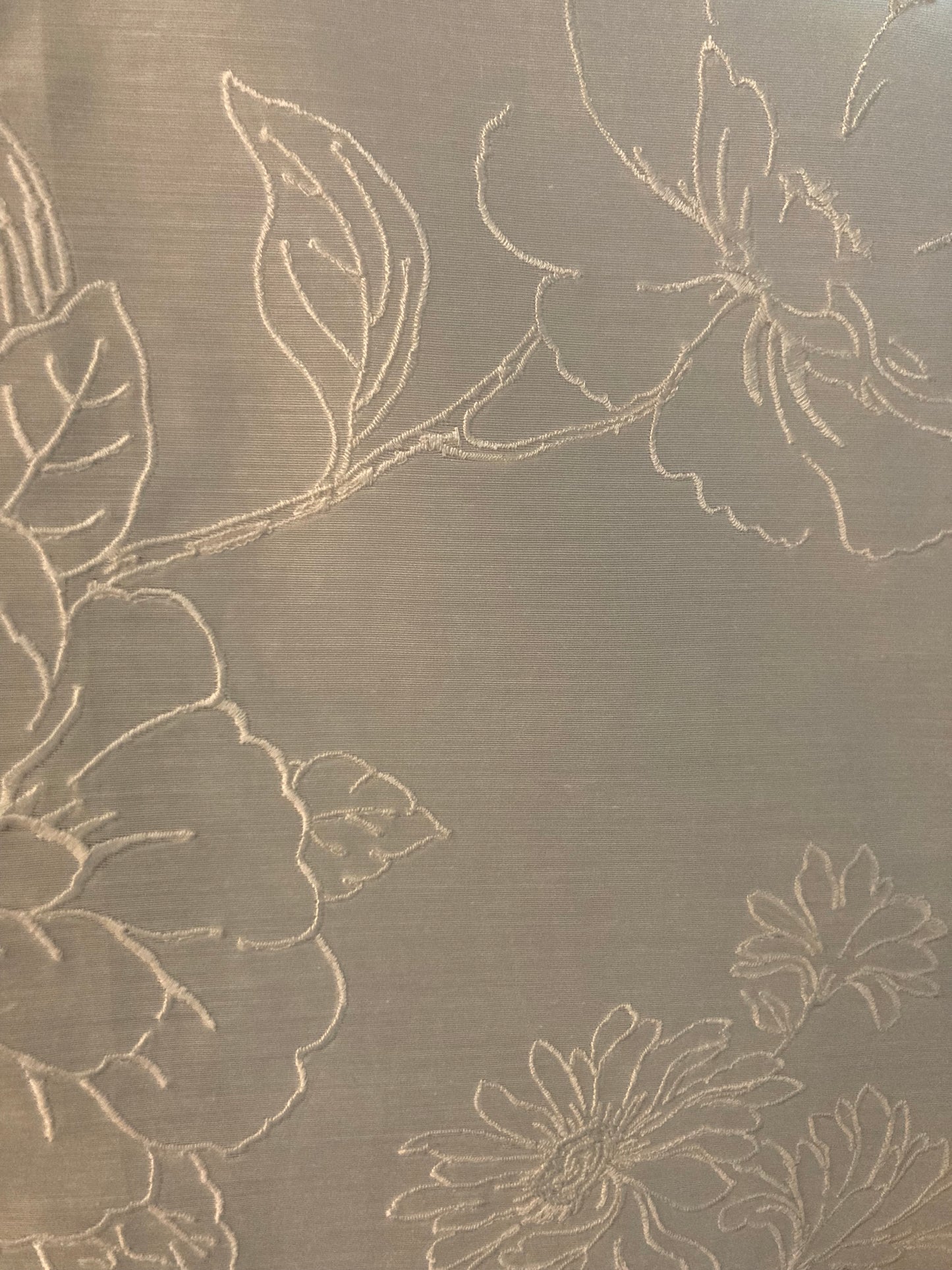 Sheer fabric with embroidered floral motifs