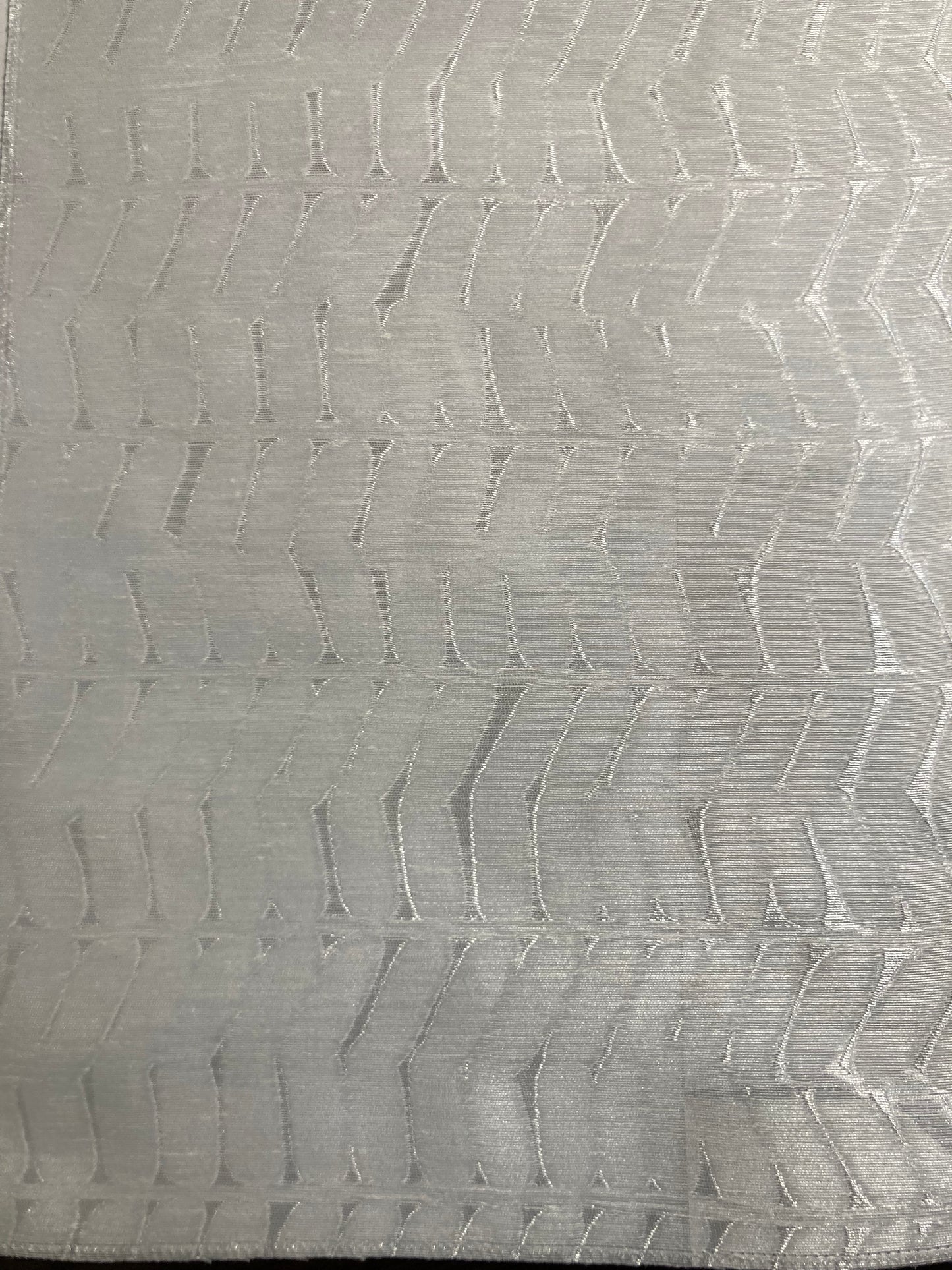 Sheer fabric with chevron motif