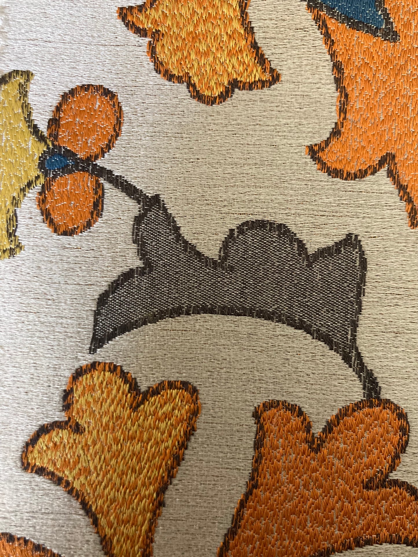 floral pattern with orange, blue and yellow gold colors on cream background